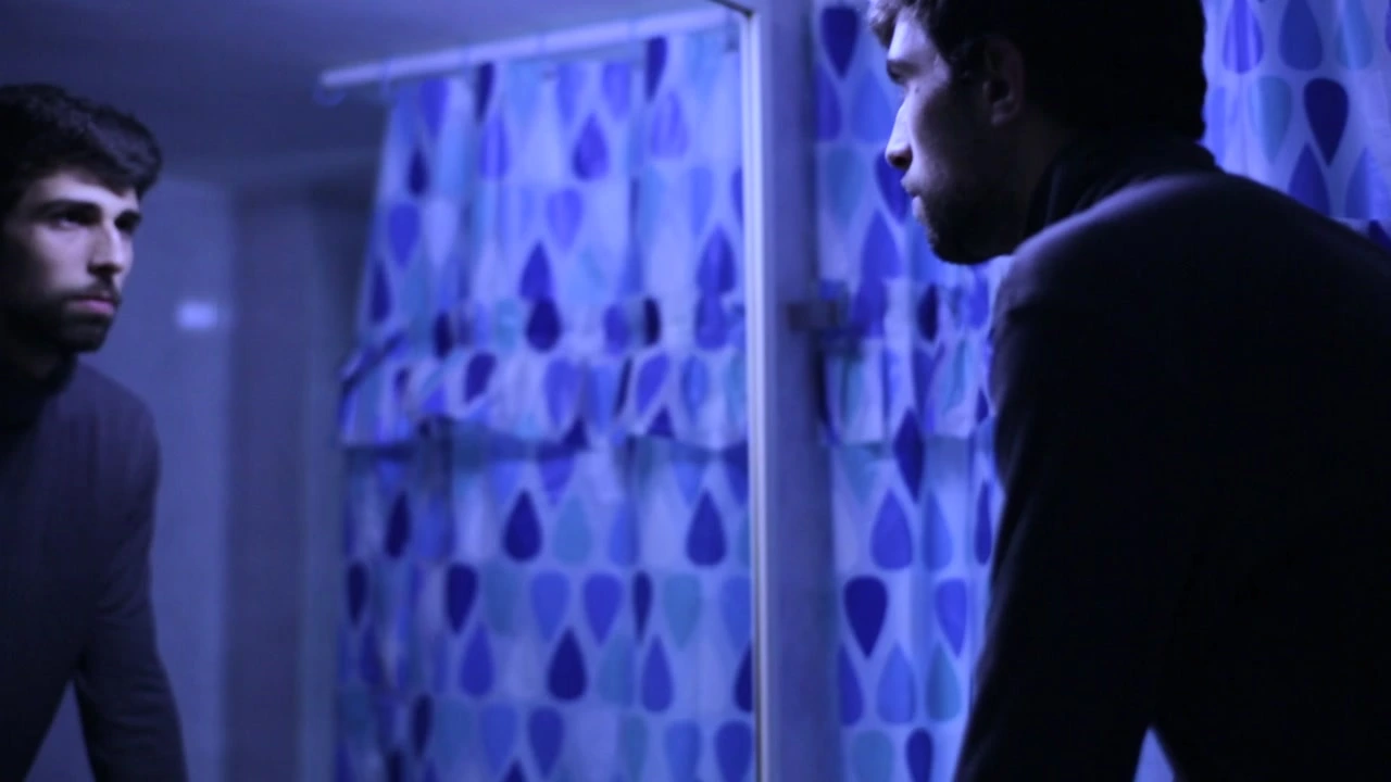 A man leans toward a mirror in a blue-lit room, with his reflection visible at the left. · Epilogue