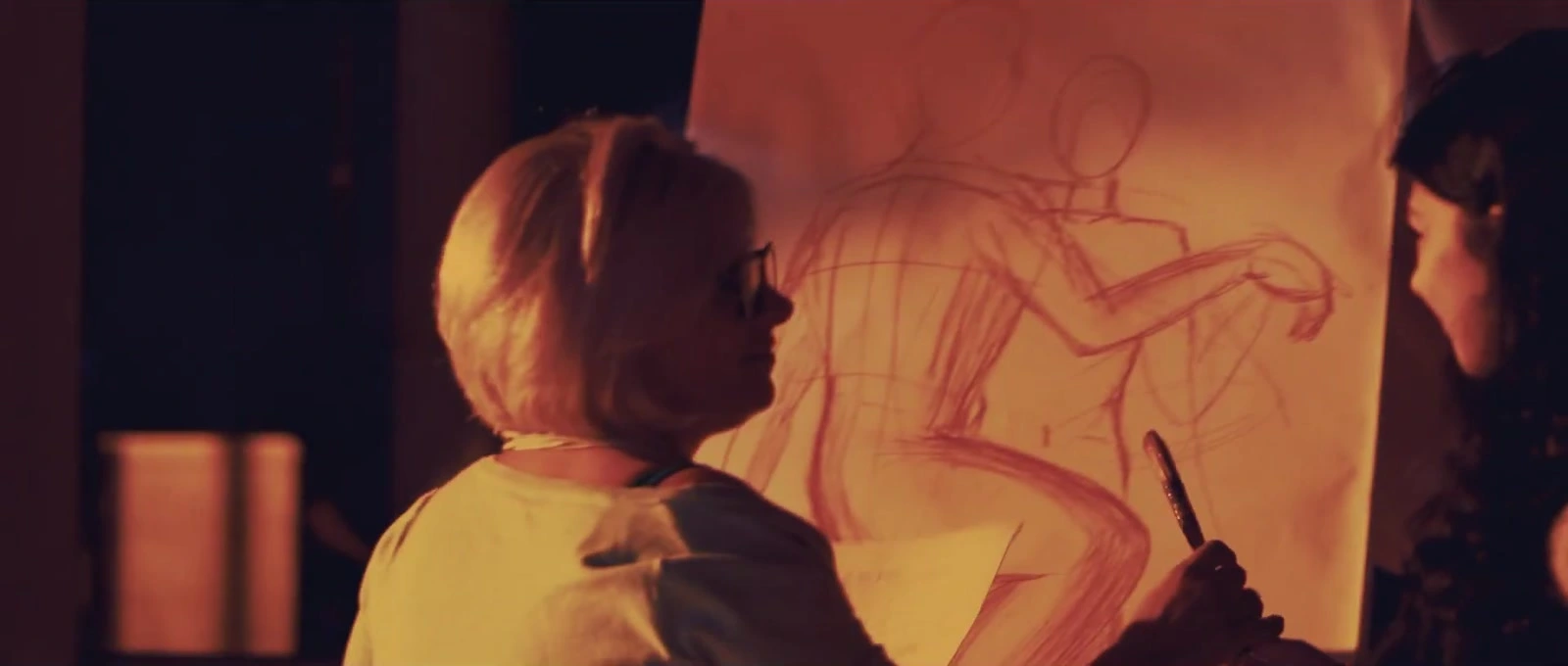 A figure drawing and performers in a scene from Scandal.