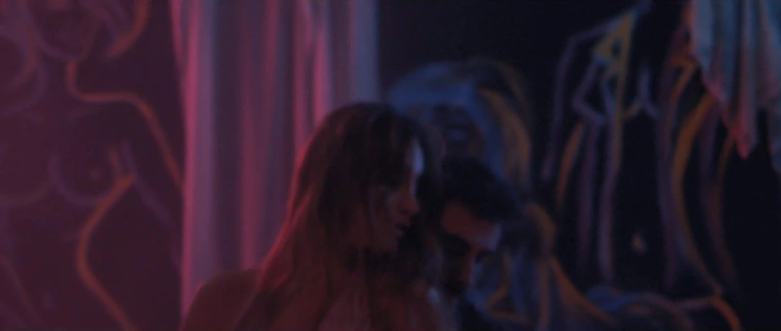 A scene from Scandal, lit in red and violet.